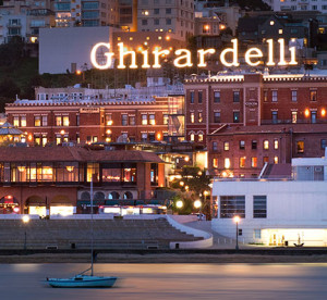 Ghirardelli Square lit logo, view from the bay