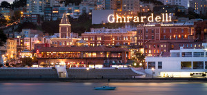 Ghirardelli Square lit logo sign, view from the bay