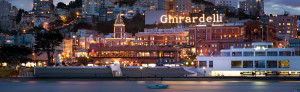Ghirardelli Square lit logo sign, view from the bay