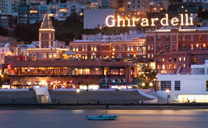 Ghirardelli Square lit logo sign, view from the bay