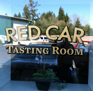Red Car Wine before window signage