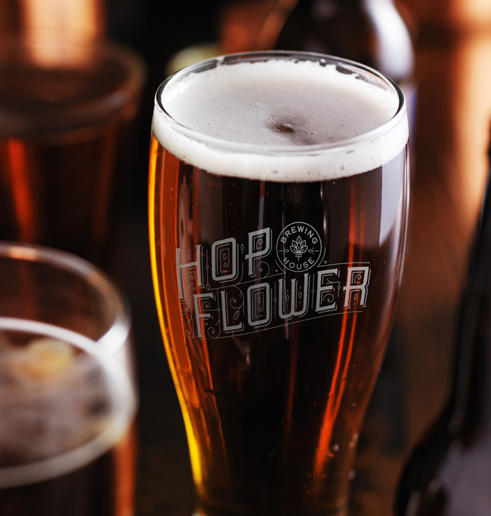 Hop Flower Brewing House branded glass