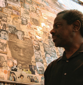 Man looking at wall of inspiring faces