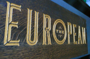 The European gold on wood sign