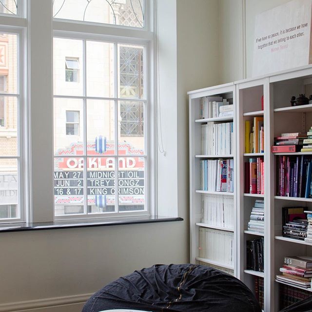 The #ChenDesign library nook—where we have impromptu team huddles, find inspiration on the shelves, and take in the best view of the Fox Theater marquee.