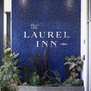 The Laurel Inn signage on blue tiles