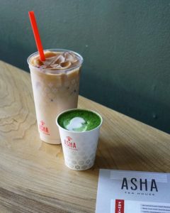 Asha Tea House branded plastic and paper cups, paper menu