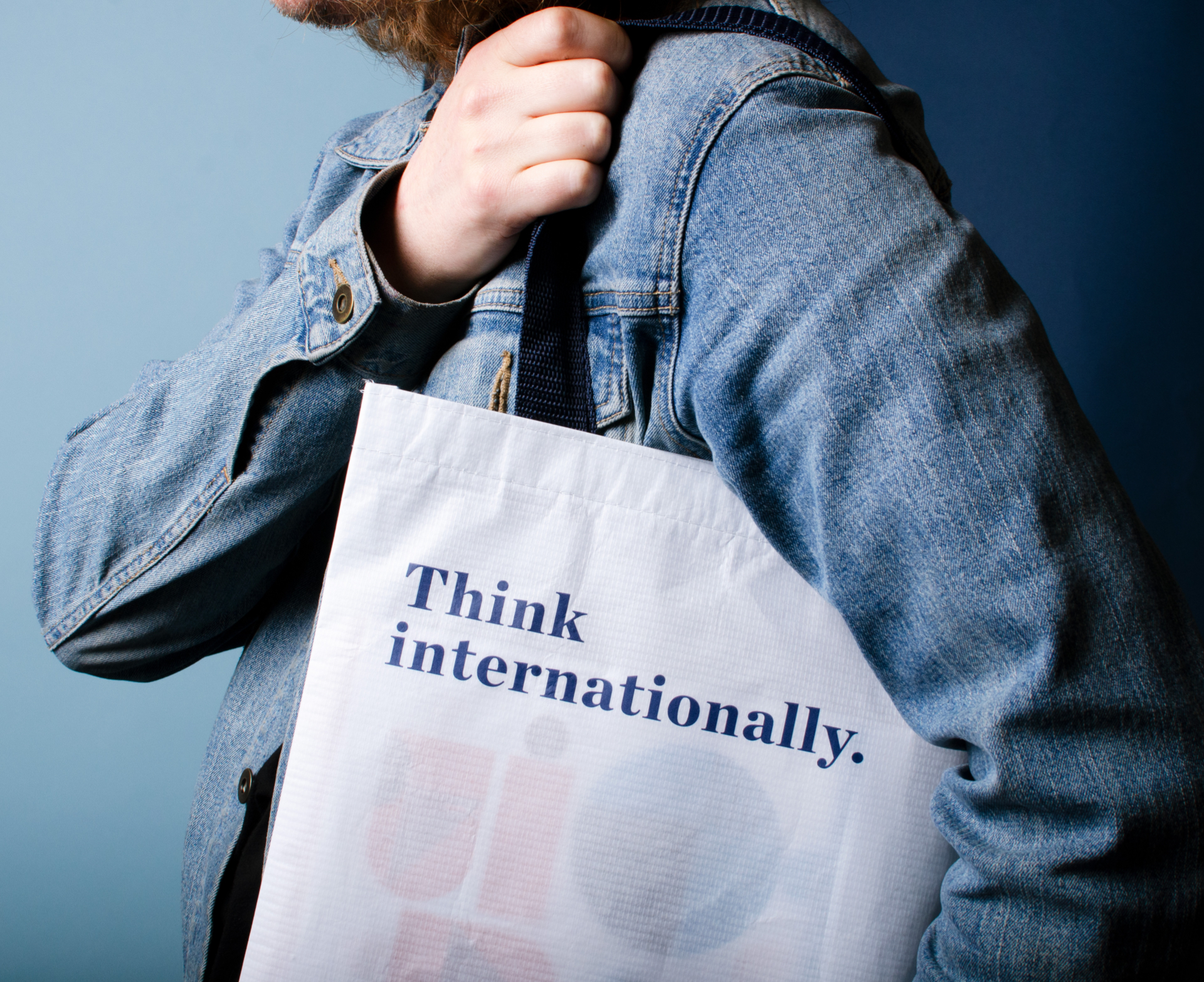 Think internationally. book bag on shoulder for French American International School and International High School
