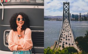 Woman with sunglasses smiling; view of western span of SF Bay Bridge