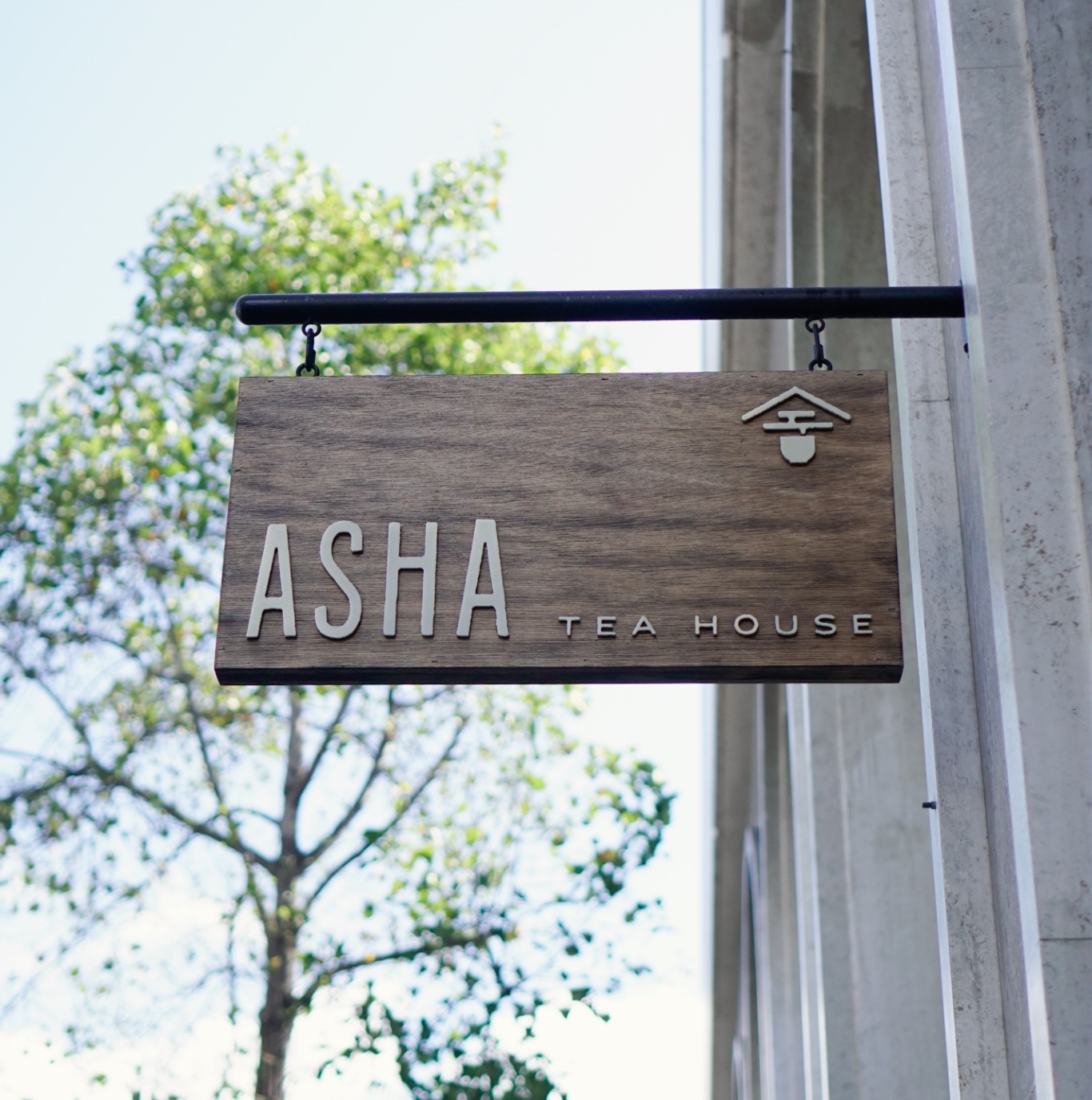 Asha Tea House blade sign