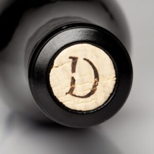 Top view of Darling Wines monogram on a cork in a wine bottle