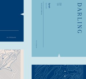 Cropped grid of branded labels for Darling Wines packaging in deep blue, sea blue and cream