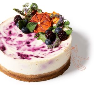 Product photo of berry cheesecake decorated with flowers and fruits overlaid with illustration of woman sliding down with cookie glasses