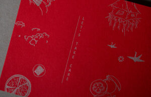 Detail of red band, "Let's Take Care" with custom illustrations
