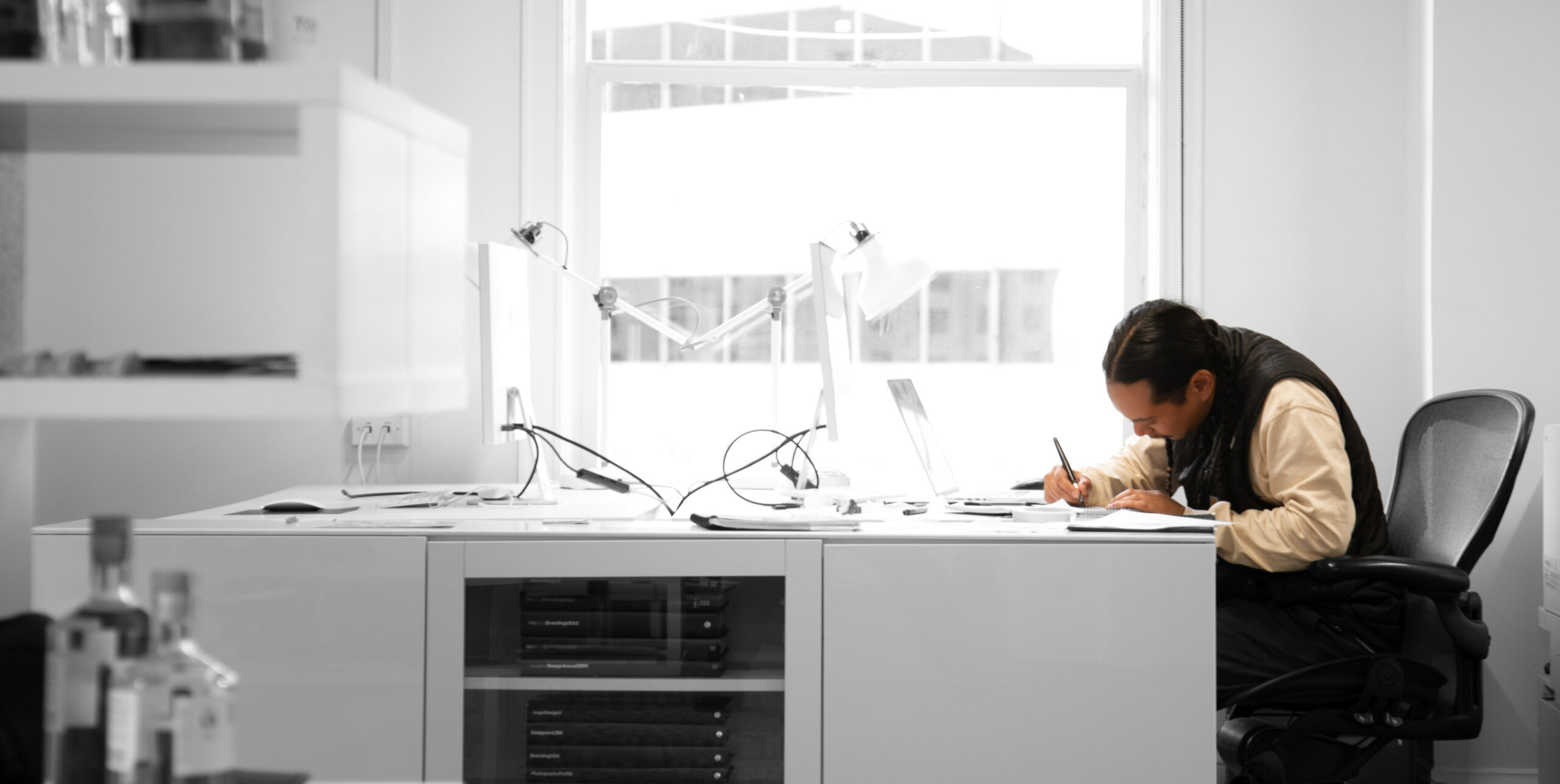 Photo of Thavin working at desk