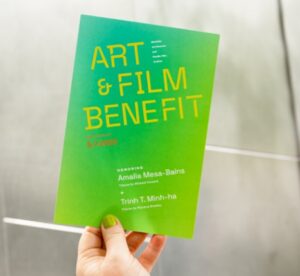 Photo of hand holding BAMPFA Art & Film Benefit event invite