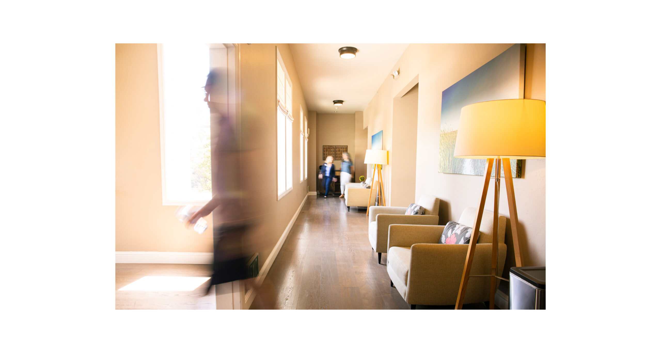 Image of people walking through hallway